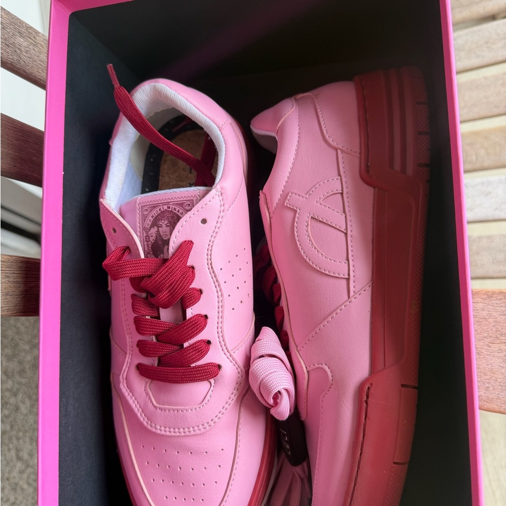 Trendy Pink Sneakers with Red Accents